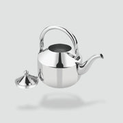 Polished stainless steel tea kettle with curved spout and open lid against white background